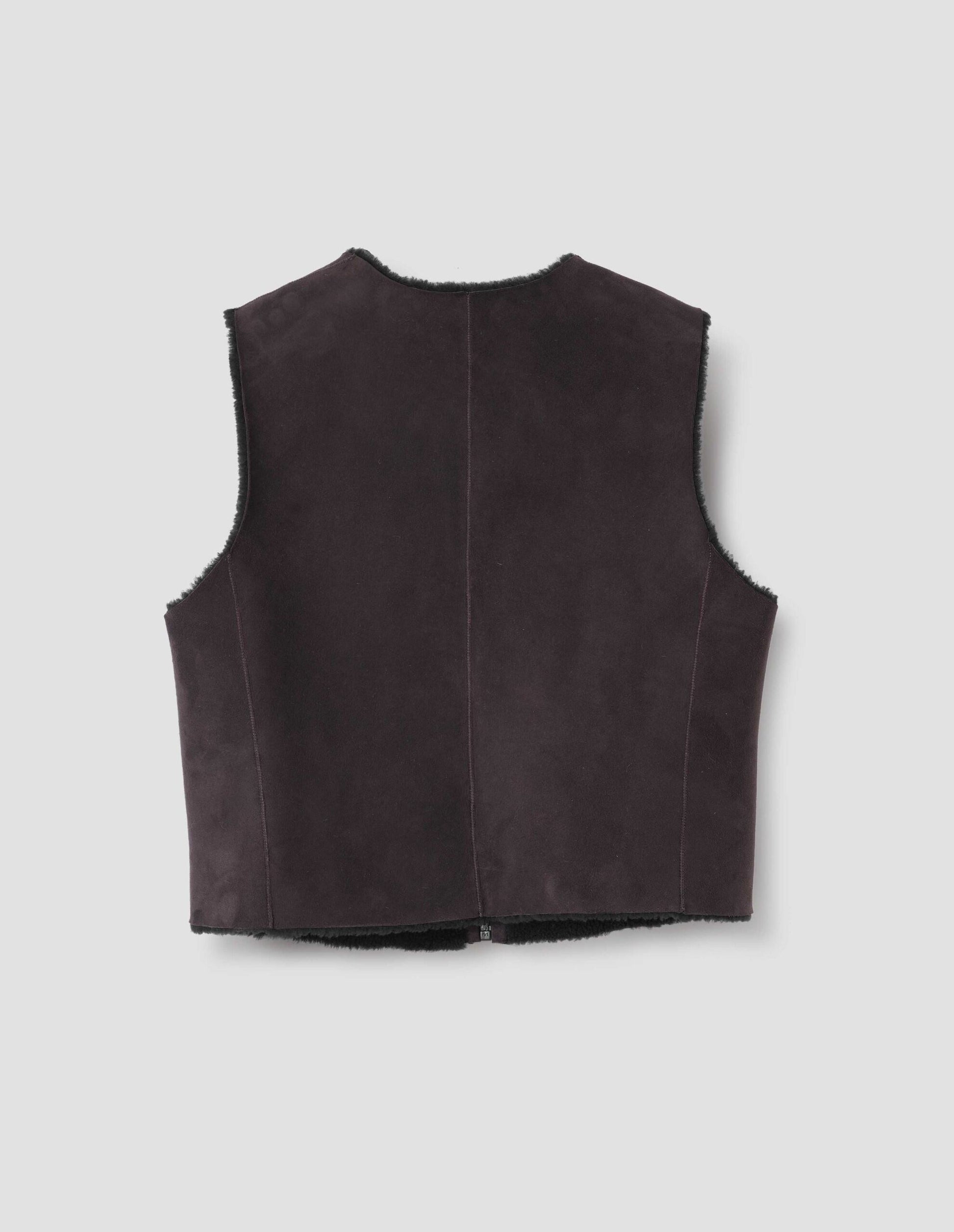 Brown and black reversible sleeveless gilet with  raw edge finish on neck, armhole and hem. Back flat lay view.