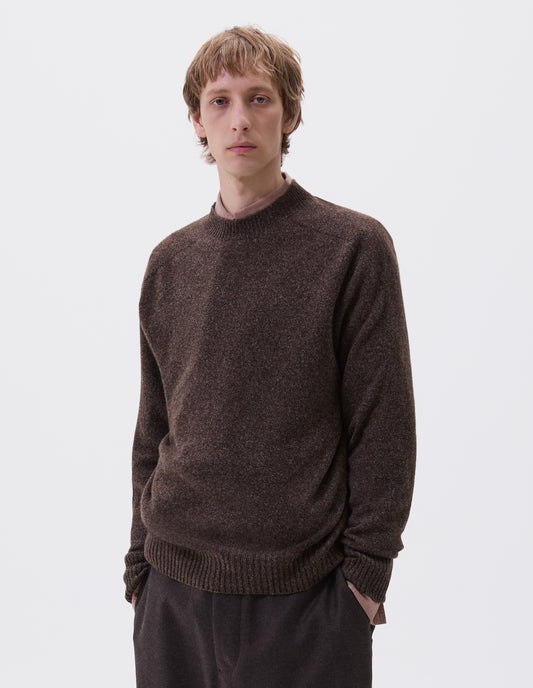 Cropped body image, front view of model wearing brown marl long sleeve jumper with contrast rib neckline, cuffs and hem. Styled with brown trousers and pink shirt.