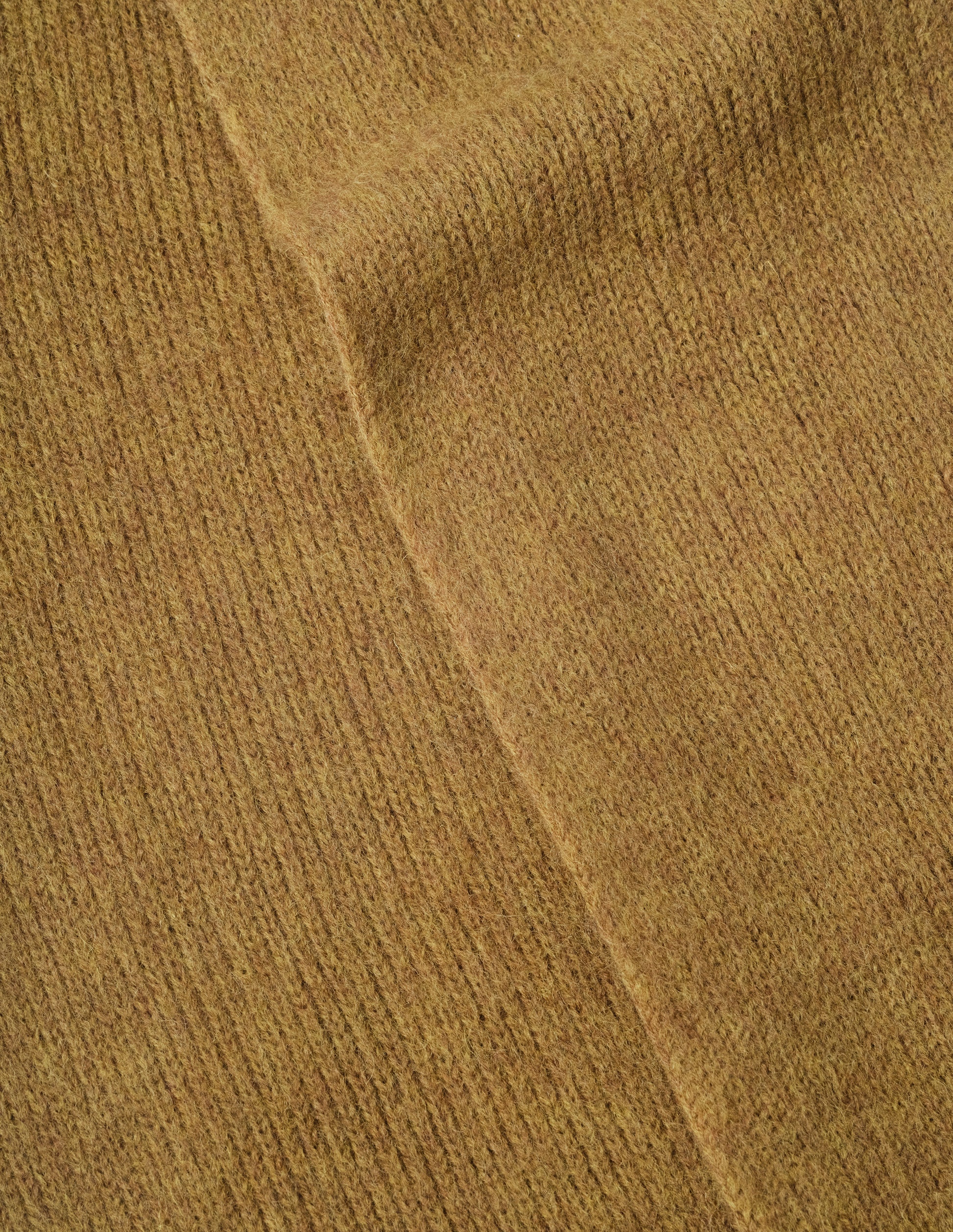 Yellow knitted wool scarf, fabric swatch.