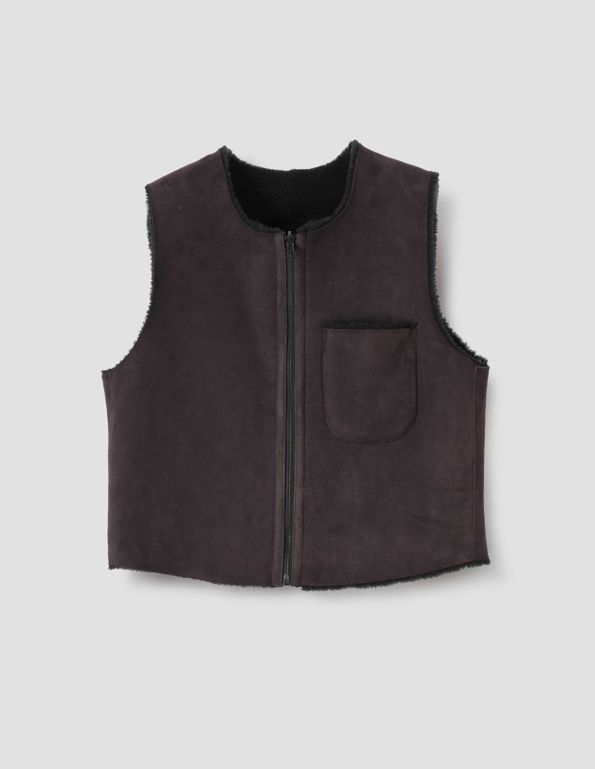 Brown and black reversible sleeveless gilet with patch pocket, zip closure and raw edge finish on neck, armhole and hem. Front flat lay view.