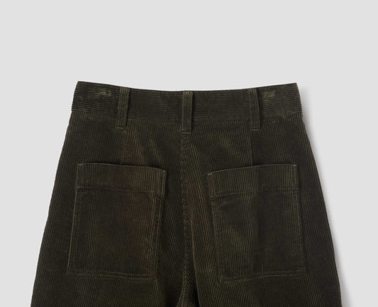 Dark green corduroy cropped trousers, with belt loops and patch back pockets. Back flat lay view.