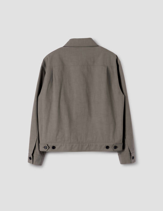 Beige jacket with horn button cuffs and waist tab adjusters, back flat lay view. 