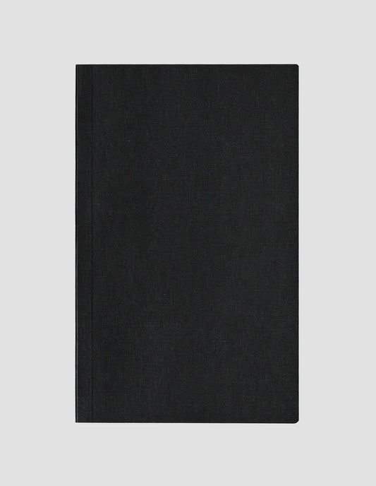 A flat lay view of the black paper cloth notebook cover.