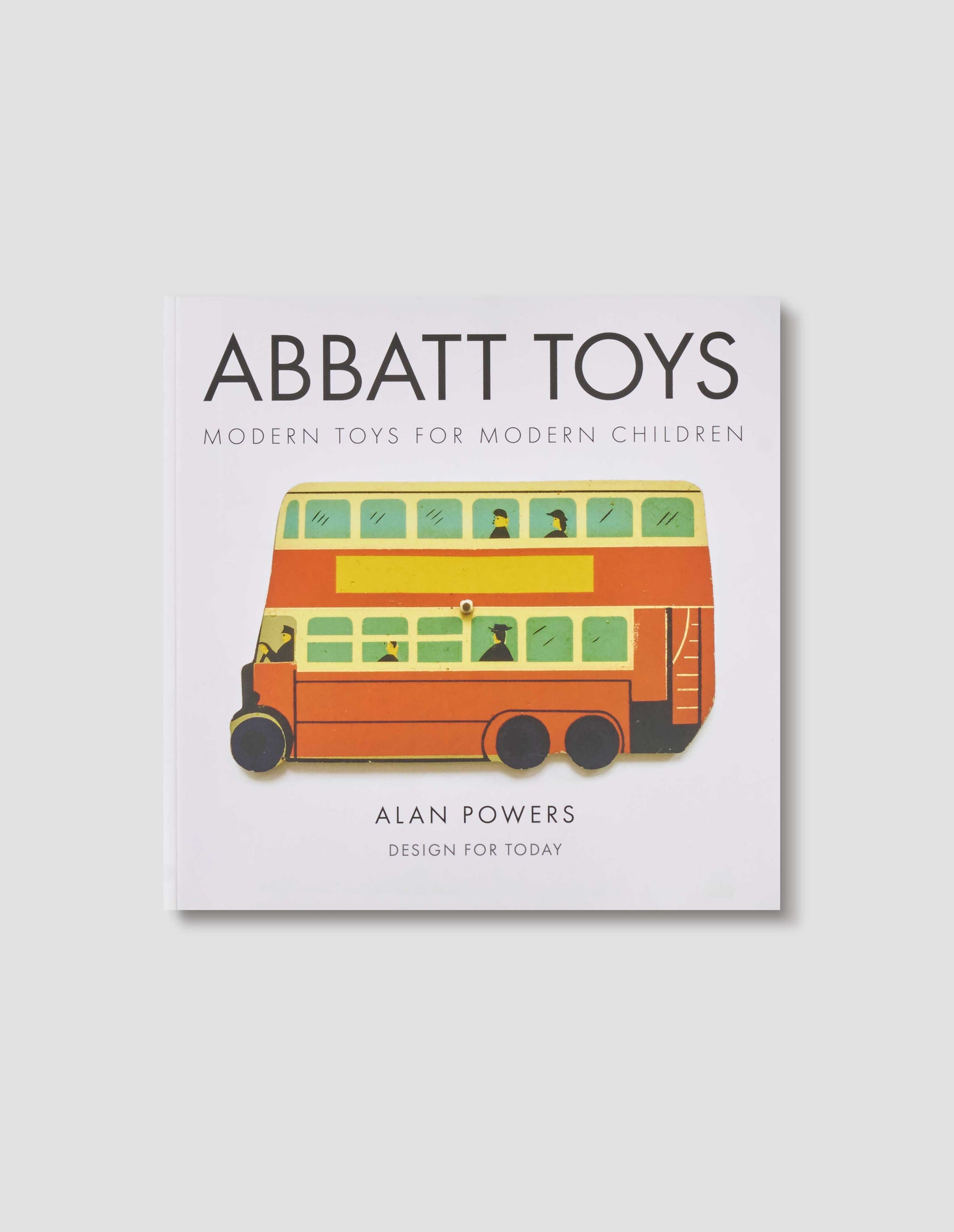 Front cover design of the book 'Abbatt toys - Modern toys for modern children' by Alan Powers, showing a flat lay image of a wooden cut out red London Routemaster bus.