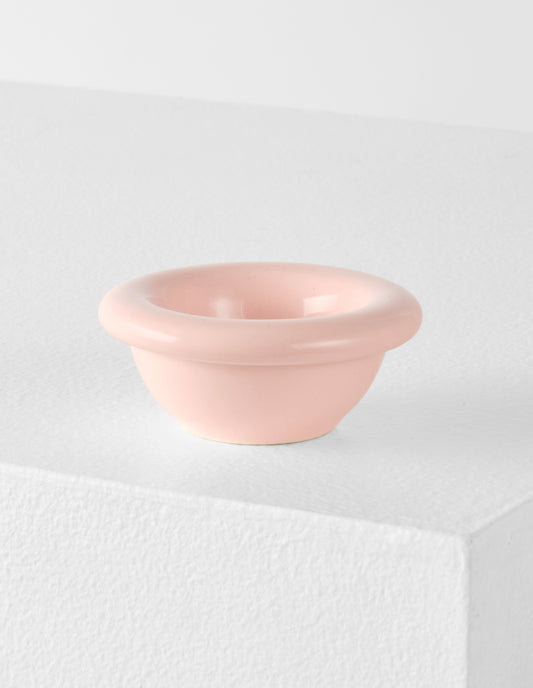 A single pink high gloss stoneware Bronto egg cup on a white plinth.