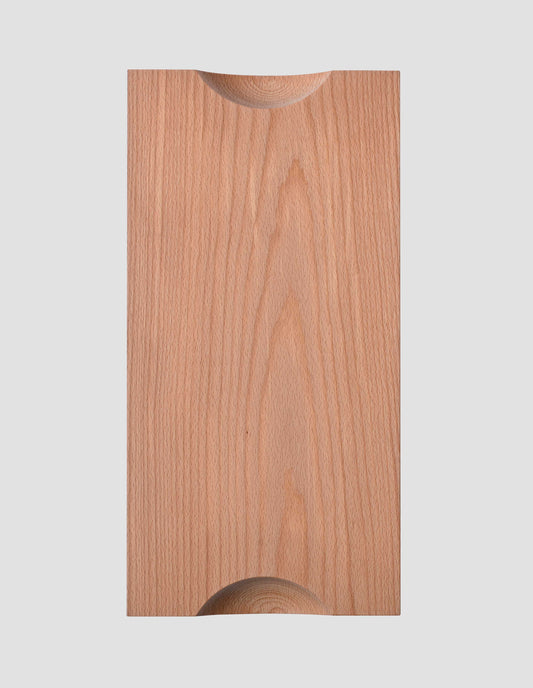 A flat lay view of the under side of the natural beech wood chopping board clearly showing the two cut away semi circles that make the board easy to lift.