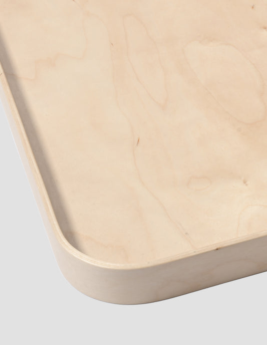 A close up of the rim of the square tray showing the layer of birch ply.