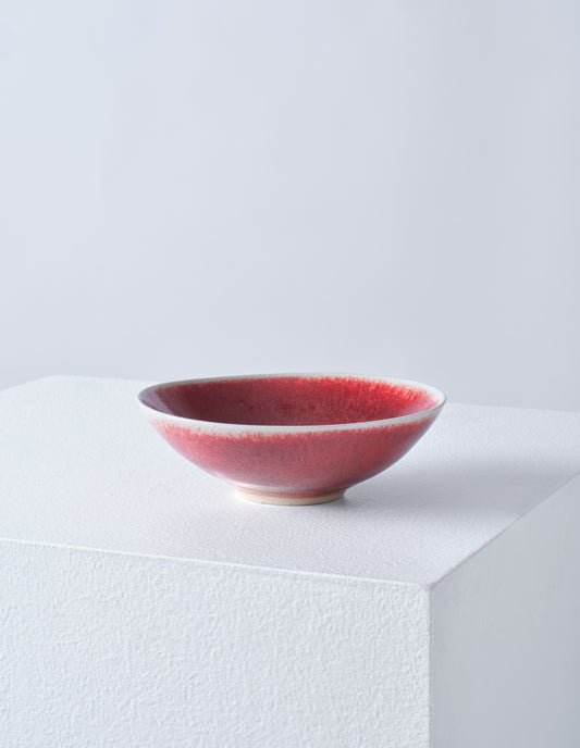 Front view of dark red stoneware small bowl.