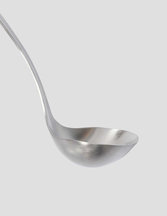 A detailed view of the satin finish stainless steel bowl showcasing the delicate curve of the design.