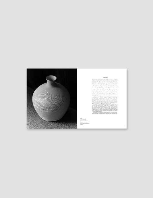 An image from the book featuring a black and white photograph of an artwork on the left side, and the text and artwork details on the right side. Flat lay image on a light grey background.