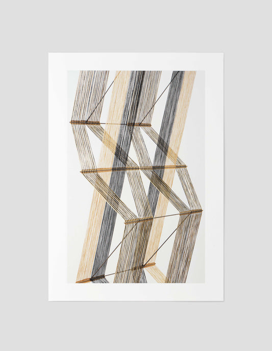A beige, brown and white print of a Peter Collingwood macrogauze woven wall hanging on a pale background, front flat lay view. 
