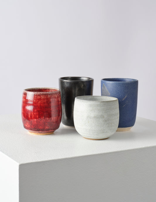 A group of Keiko Hasegawa stoneware beakers in various styles and colour glazes.