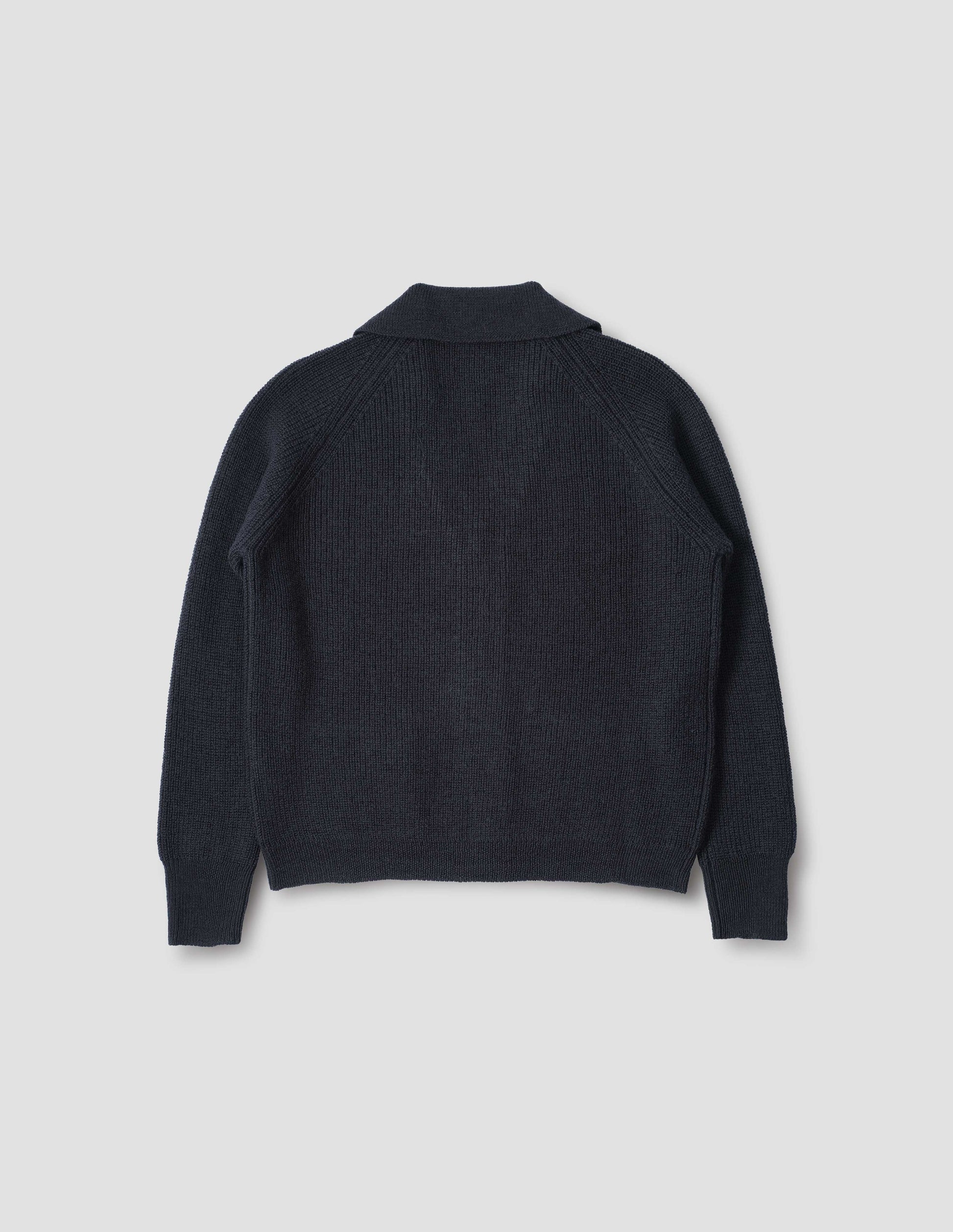 Dark navy blue collared cardigan, with contrast rib on collar, placket, cuff and hem. Back flat lay view.