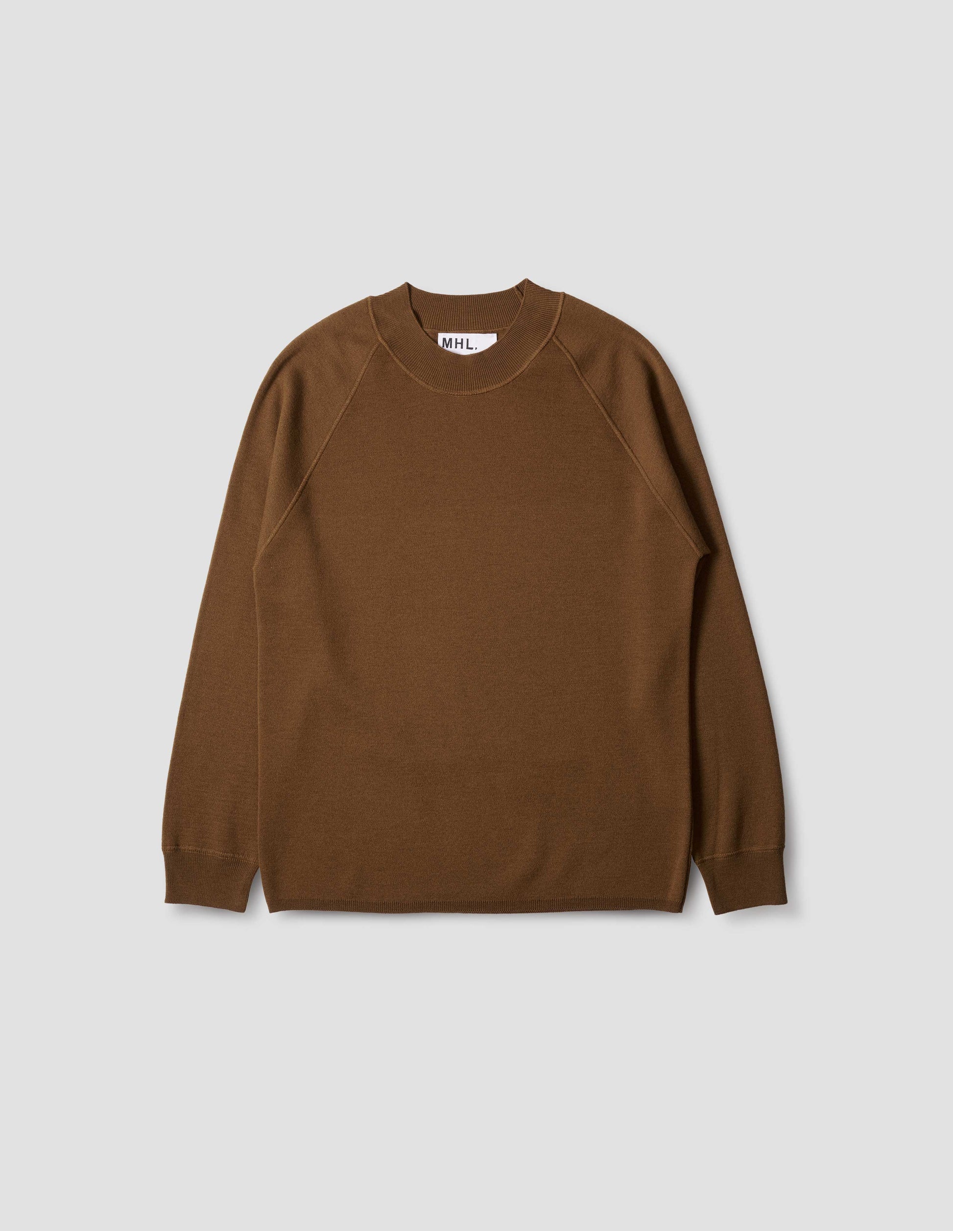 Brown merino wool wide neck sweatshirt, with raglan sleeve, flatlock stitch detailing on seams and contrasting rib on neck, cuffs and hem. Front flat lay view.