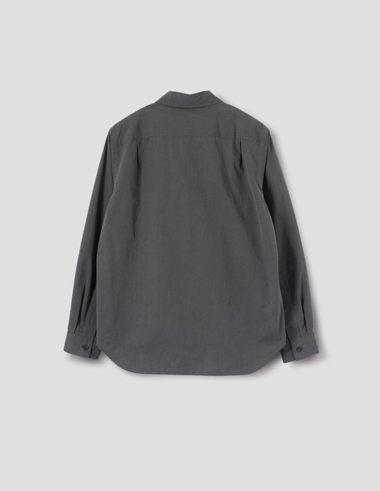 Dark grey shirt with curved hem, pleats on back yoke and horn buttons on cuffs. Back flat lay view.