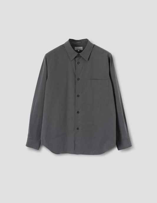 Dark grey shirt with chest pocket, horn buttons and curved hem. Front flat lay view.