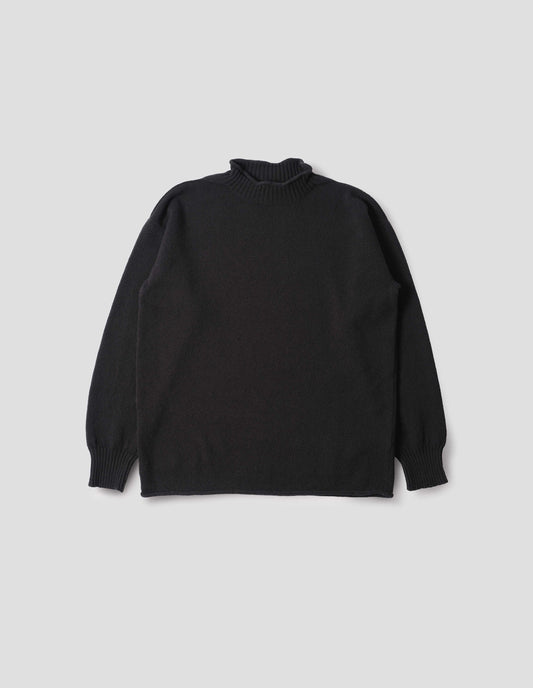 Black long sleeve jumper with rolled edge neck and hem and contrasting rib on neck and sleeves. Front flat lay view.