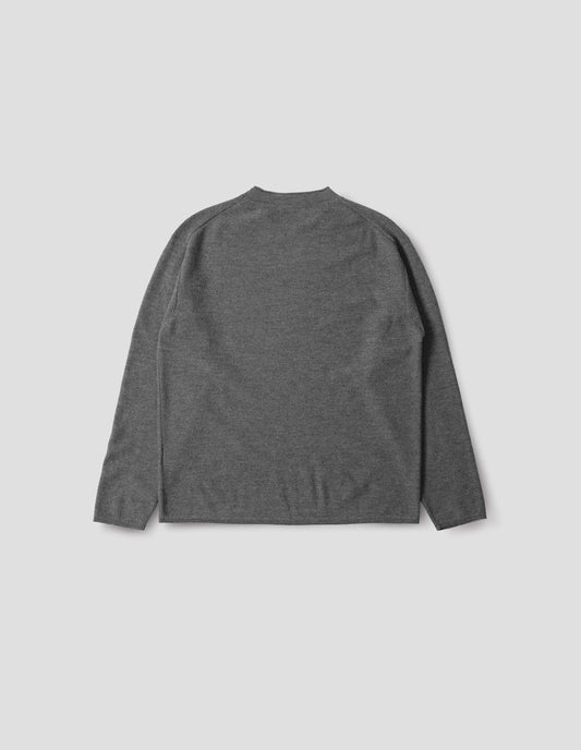 Grey crew neck jumper with rolled edge detailing on neck, rib trim on cuffs and hem. Back flat lay view.