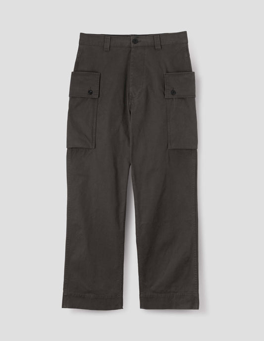 Brown cargo trousers with deep flap button fastening patch pocket, concealed hand pockets, belt loops and deep stitch hem. Front flat lay view.