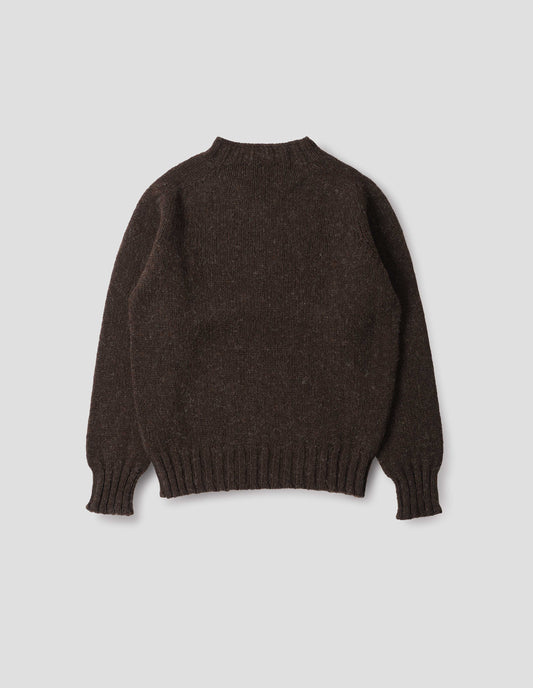 Dark brown marl jumper with saddle sleeves and contrasting rib on neck, cuffs and hem. Back flat lay view. 