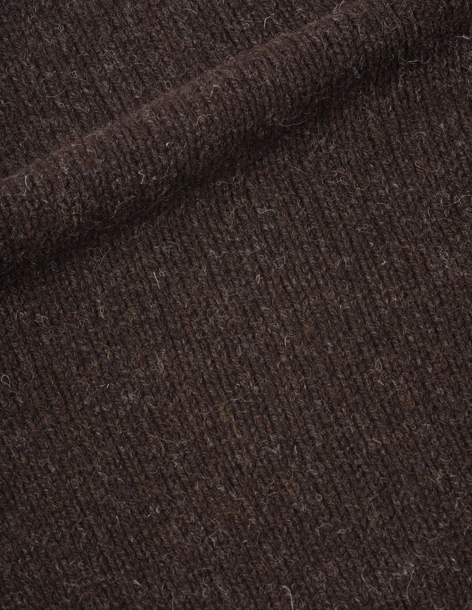 Dark brown rustic wool jumper, fabric swatch. 