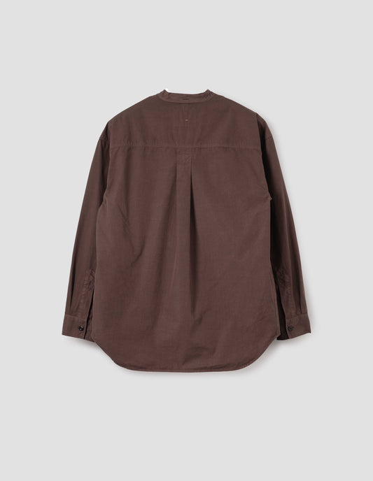 Brownish red cotton collarless shirt, with curved side gusset, box pleat on back yoke and corozo brace button cuffs. Back flat lay view.