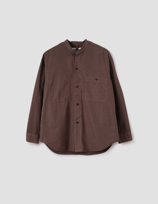 Brownish red cotton collarless shirt, with stitch through placket, button-through patch pocket and curved side gusset. Front flat lay view.