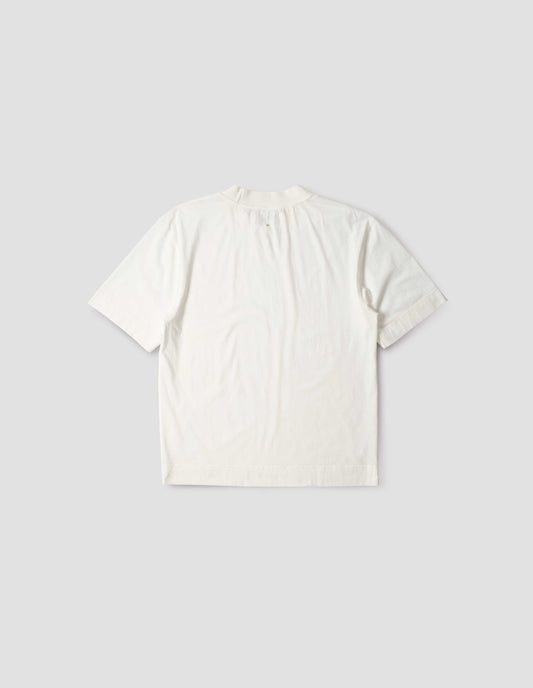 Off white t-shirt, with rib neck and flatlock stitch detailing on seams, back flat lay view.