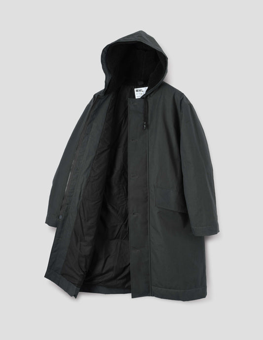 Blueish green hooded parka with fleece lined drawcord hood, two way zip fastening with button fastening storm flap and slanted flap pockets. Front flat lay open view.