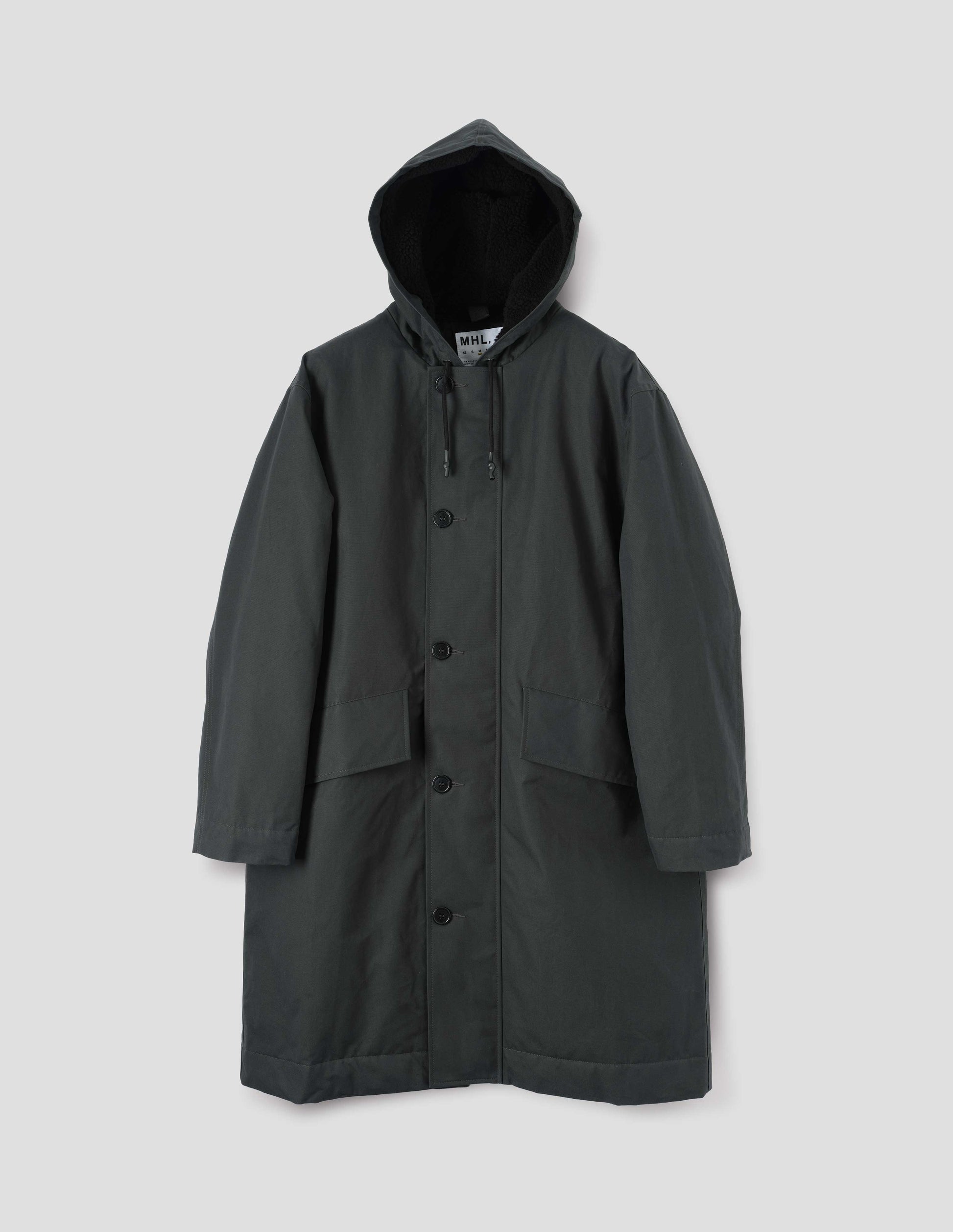 Blueish green hooded parka with fleece lined drawcord hood, two way zip fastening with button fastening storm flap and slanted flap pockets. Front flat lay view.