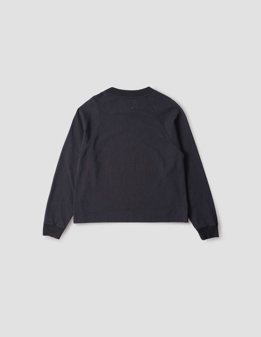 Navy blue long sleeve t-shirt with raglan sleeve, single rib trims on neck and cuffs and vent split hem. Back flat lay view.