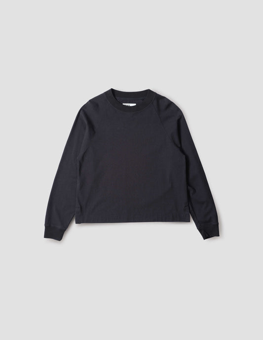 Navy blue long sleeve t-shirt with raglan sleeve, single rib trims on neck and cuffs and vent split hem. Front flat lay view.