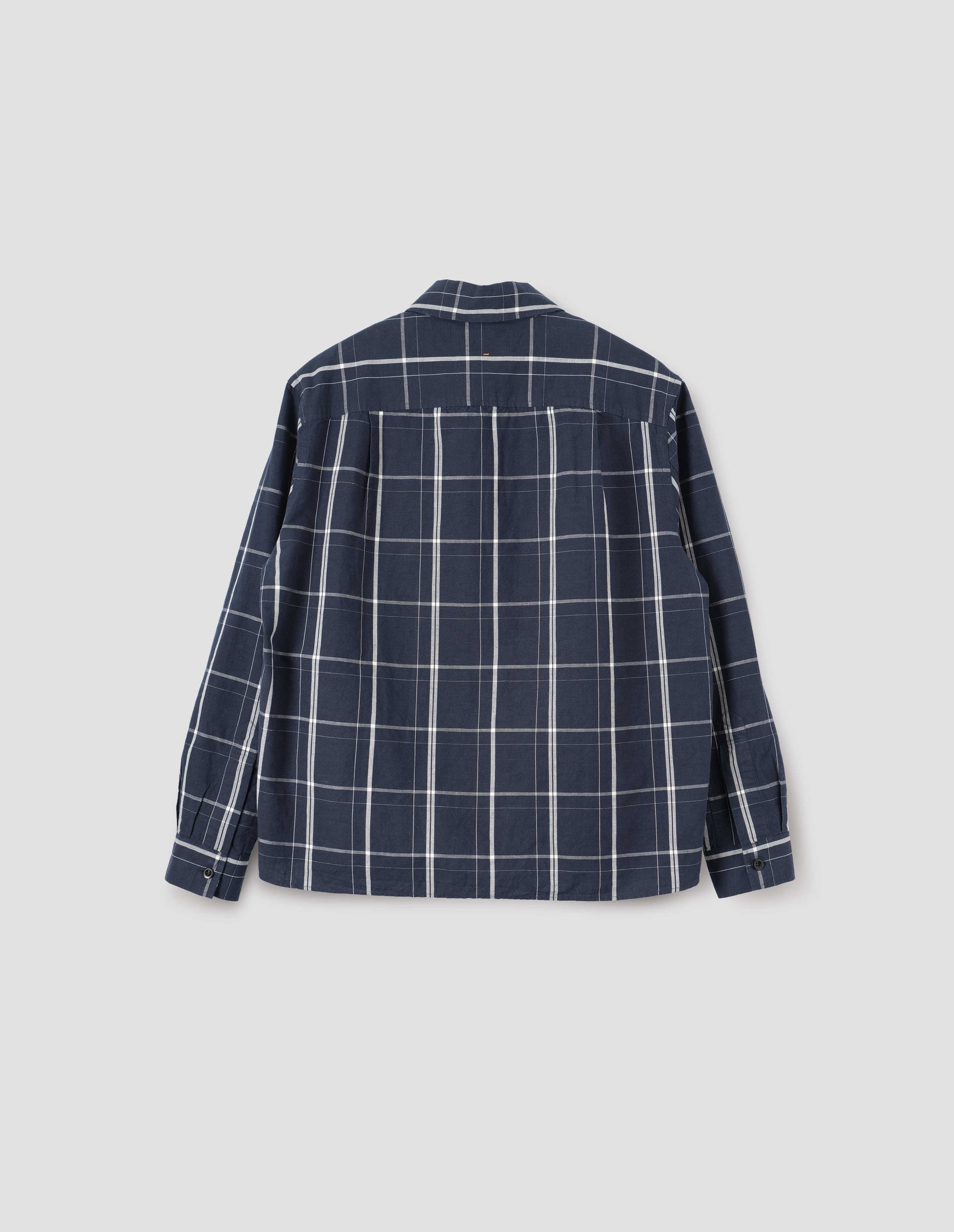 Blue and white checked long sleeve shirt. With corozo brace button cuffs and stitch side gusset detailing. Back flat lay view.