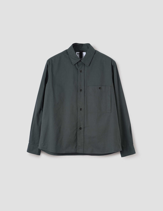 Blue green long sleeve shirt, with raised placket, button through chest patch pocket and corozo brace button closure and cuffs, front flat lay view.