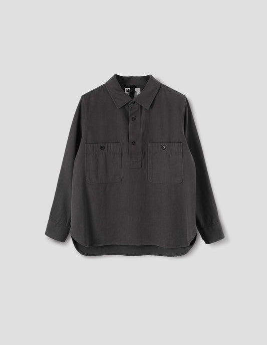 Grey overhead shirt with raised placket, box stitch detailing, button through chest patch pockets and elongated back hem. Front flat lay view.