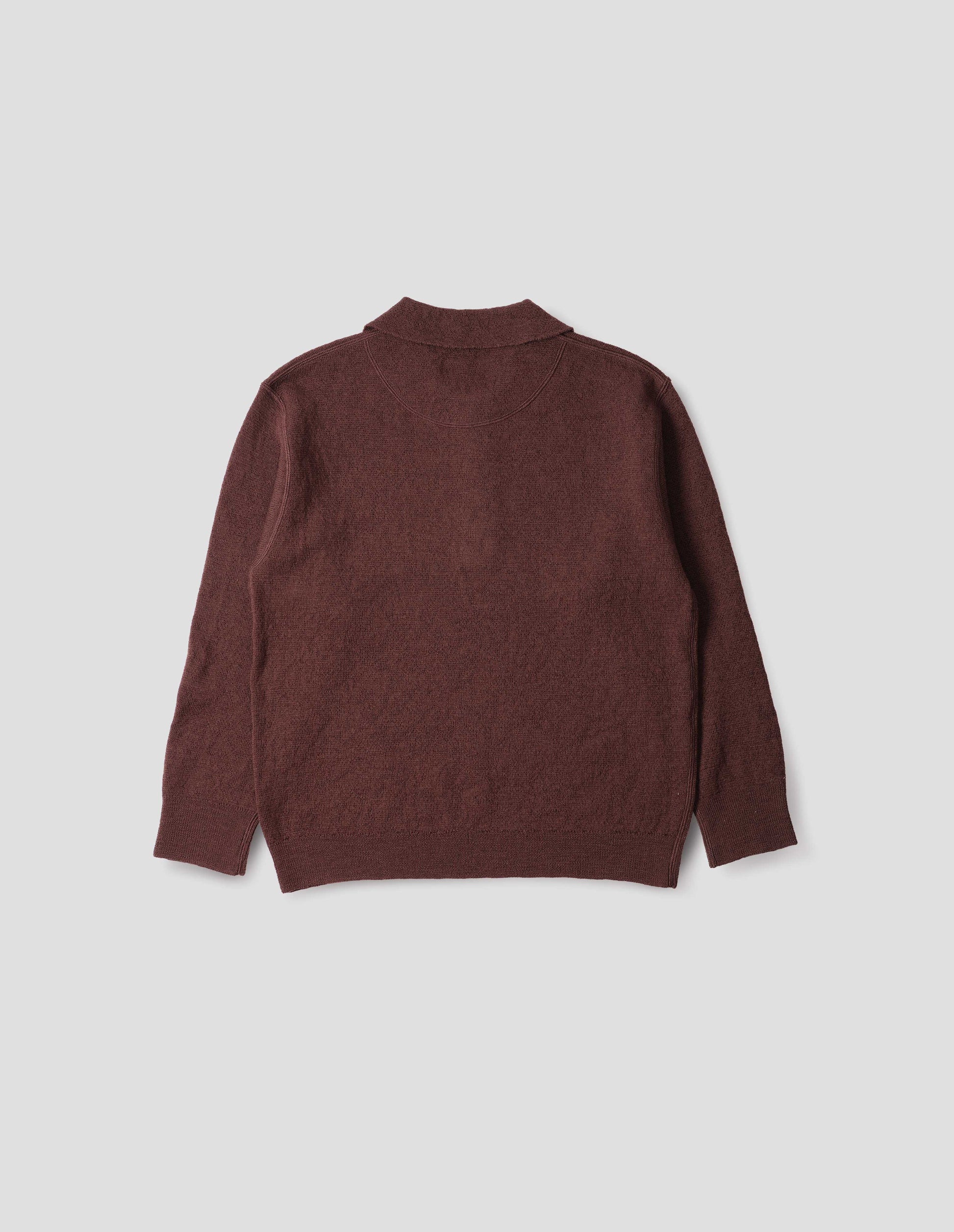 Brown knitted polo with contrast rib on neck, cuffs and hem. Back flat lay view.