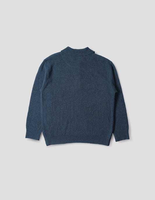 Blue knitted polo with contrast rib on neck, cuffs and hem. Back flat lay view.