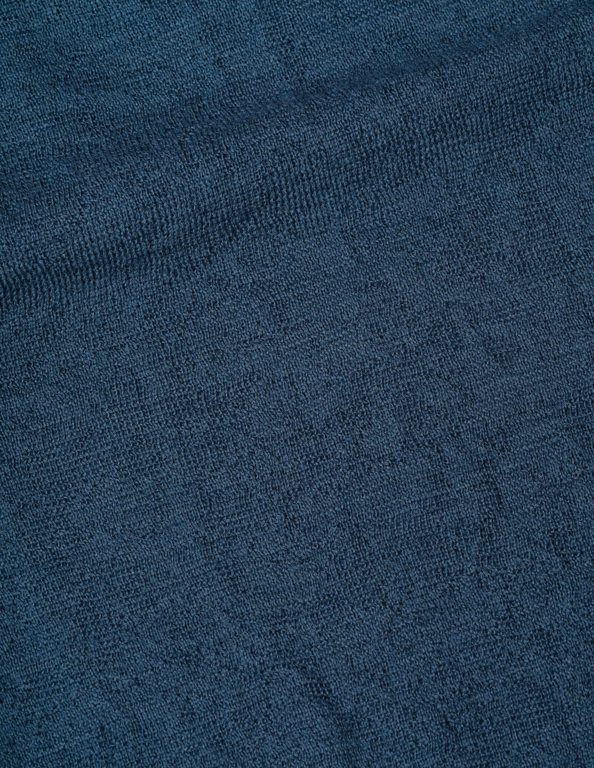 Blue dry wool knitted polo, fabric swatch.
