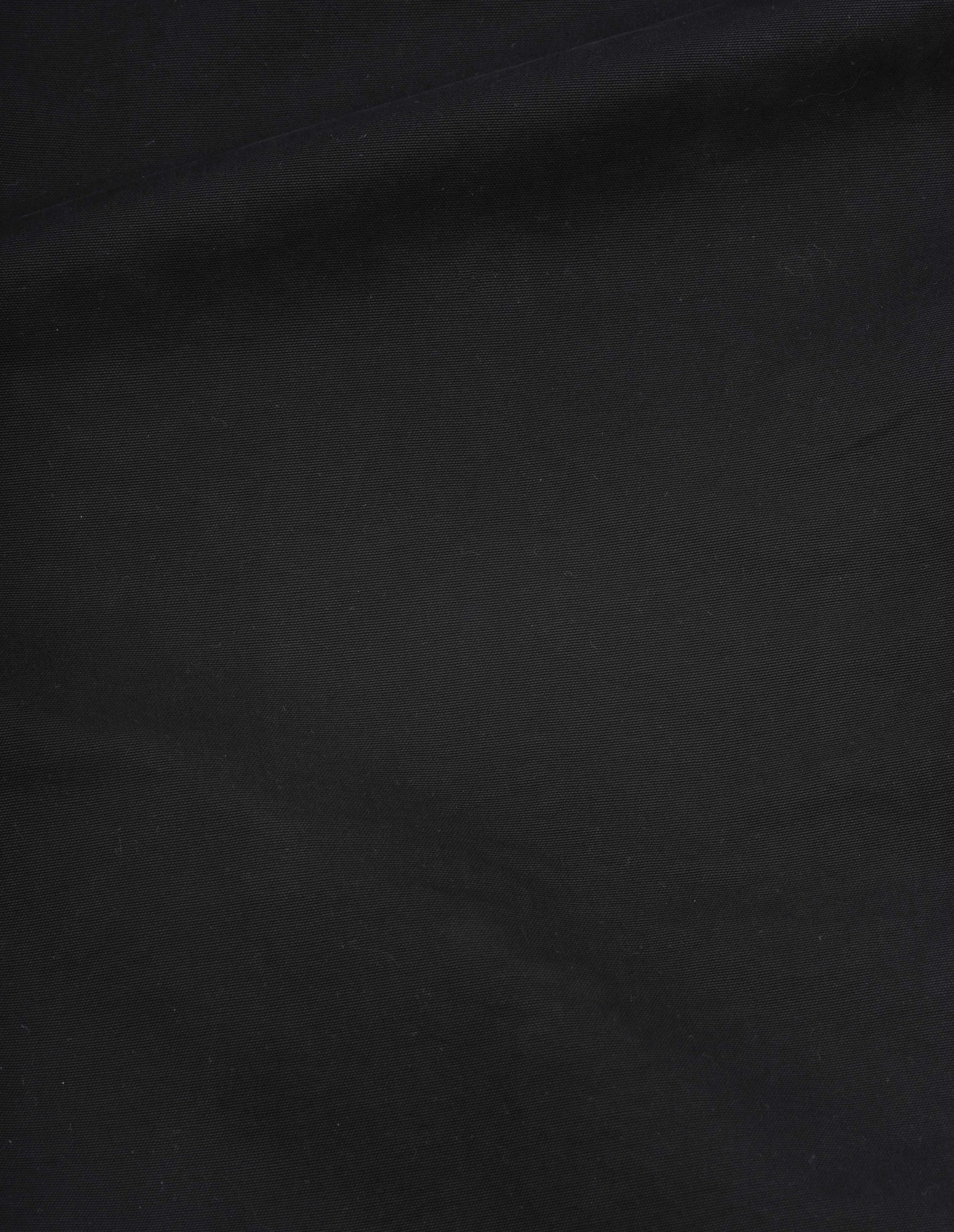 Black double twisted cotton canvas trousers fabric swatch.