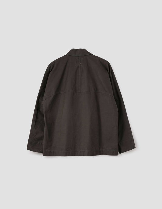 Brown raglan sleeve jacket with split panel detailing on back yoke, back flat lay view.