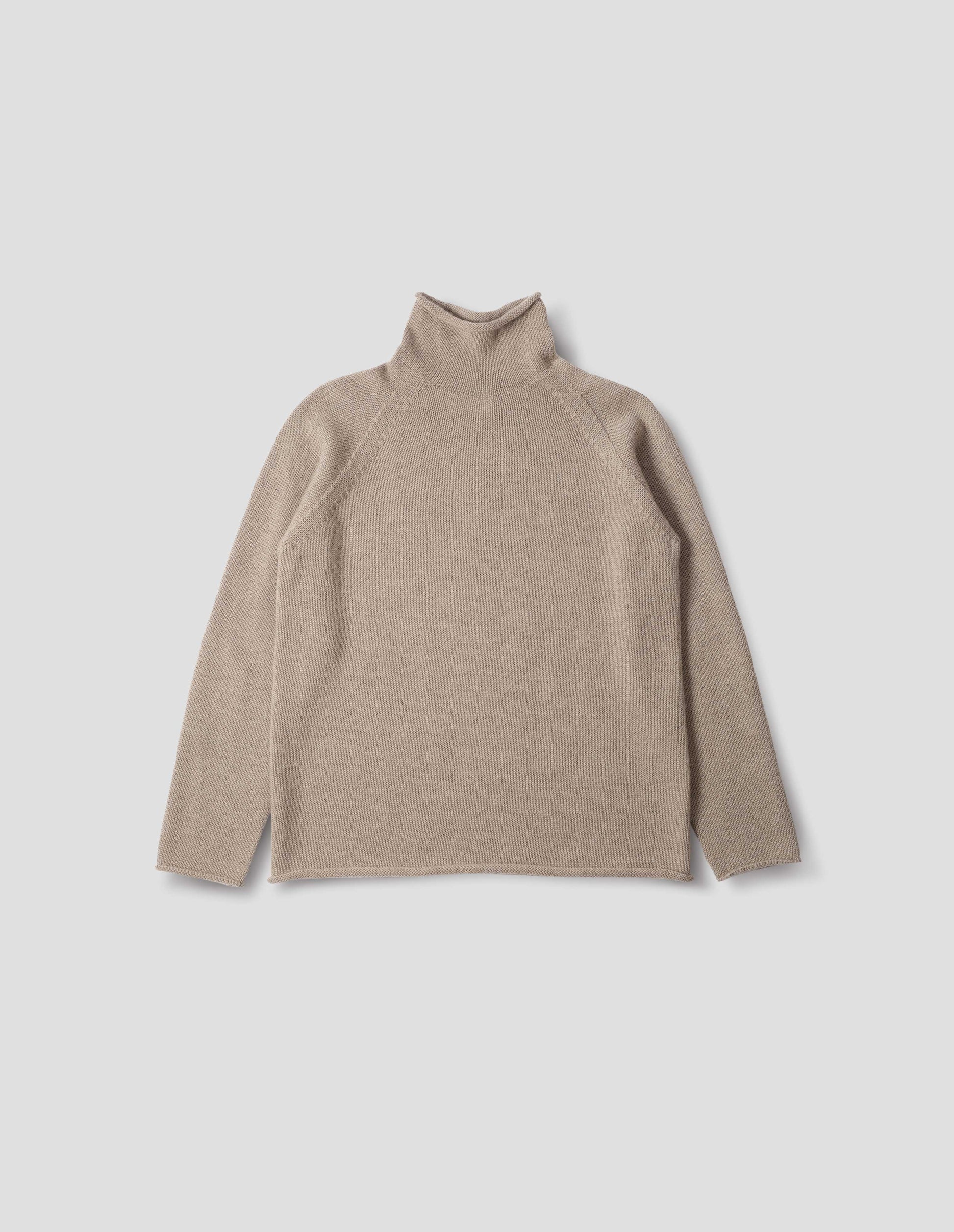 Beige roll neck jumper with seamless construction, high neck, raglan sleeve and straight cuffs and hem. Front flat lay view.