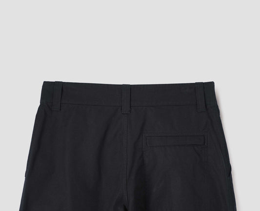 Black heavy cotton trousers, with belt loops and stitch through back pocket, back flat lay view.
