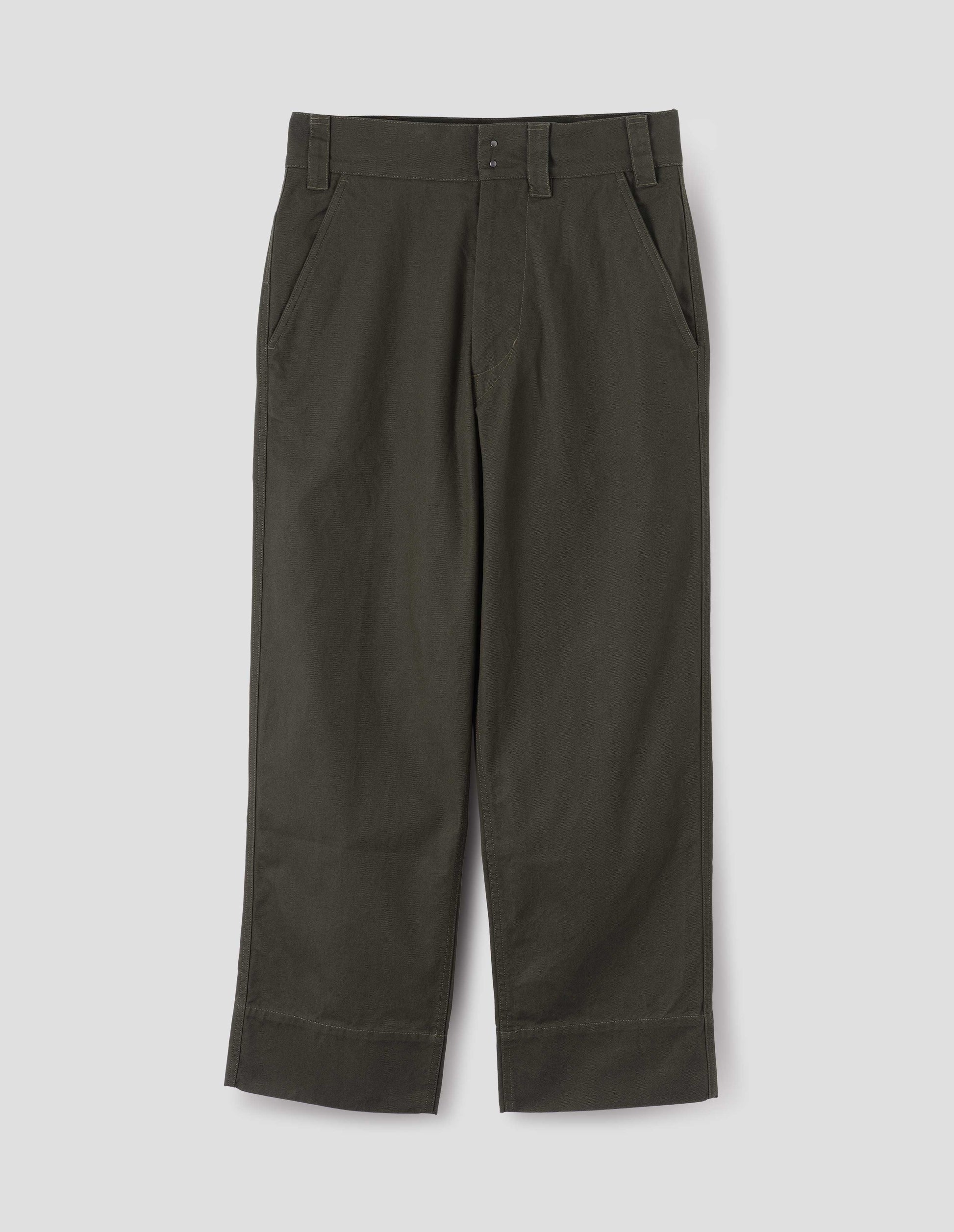 Green brown trousers with button fly, deep stitch hem, slant side pockets and exposed double rivet. Front flat lay view.