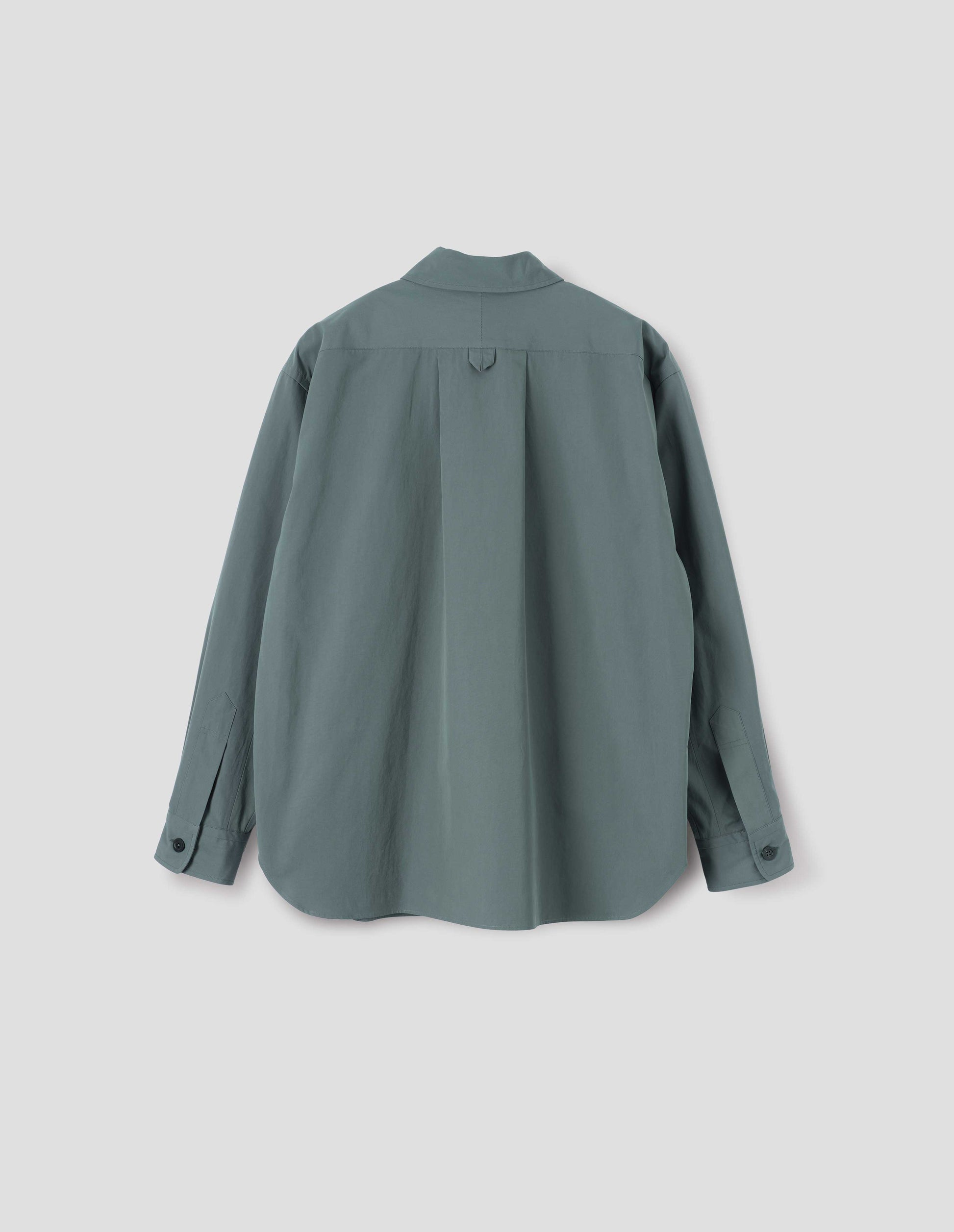 Blue shirt with hanger loop detail on back, split yoke and horn buttons on cuffs. Back flat lay view.