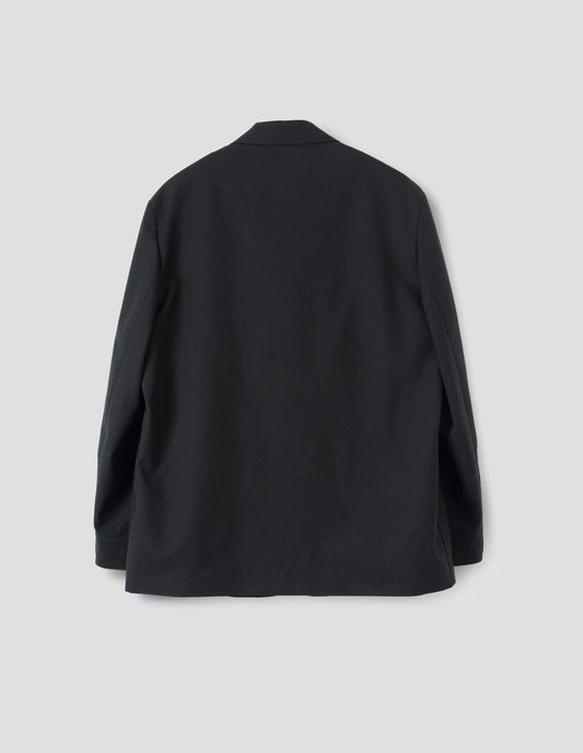 Black wool blazer with horn button shirt cuffs. Back flat lay view.