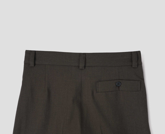 Brownish green wool trousers with concealed side pockets, belt loops and deep button through welt back pocket. Back flat lay view. 