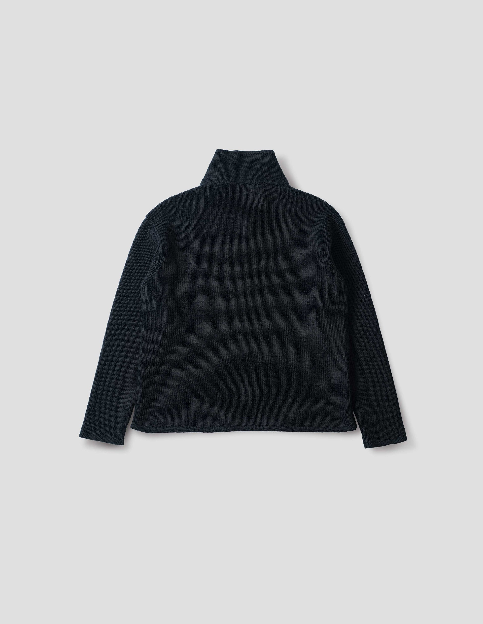 Black zip through wool cardigan with straight hem and cuffs. Back flat lay view.