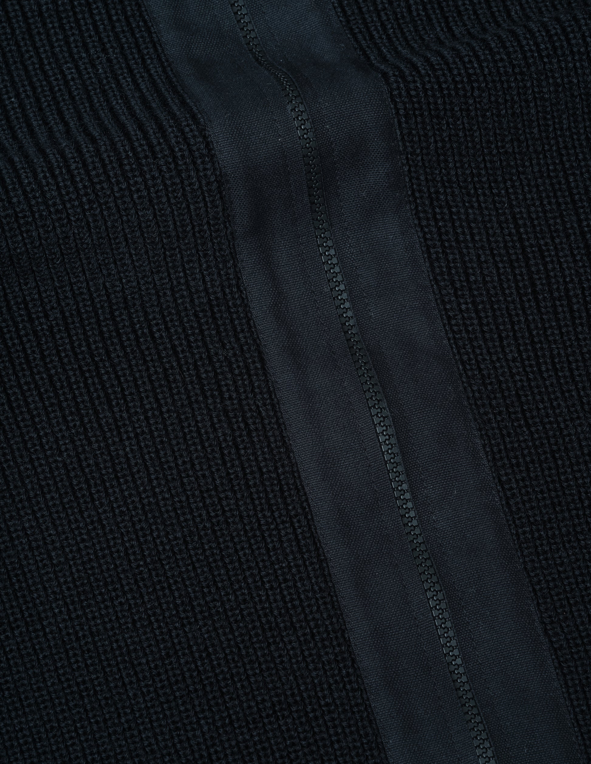 Black dry wool zip through cardigan, fabric swatch. 