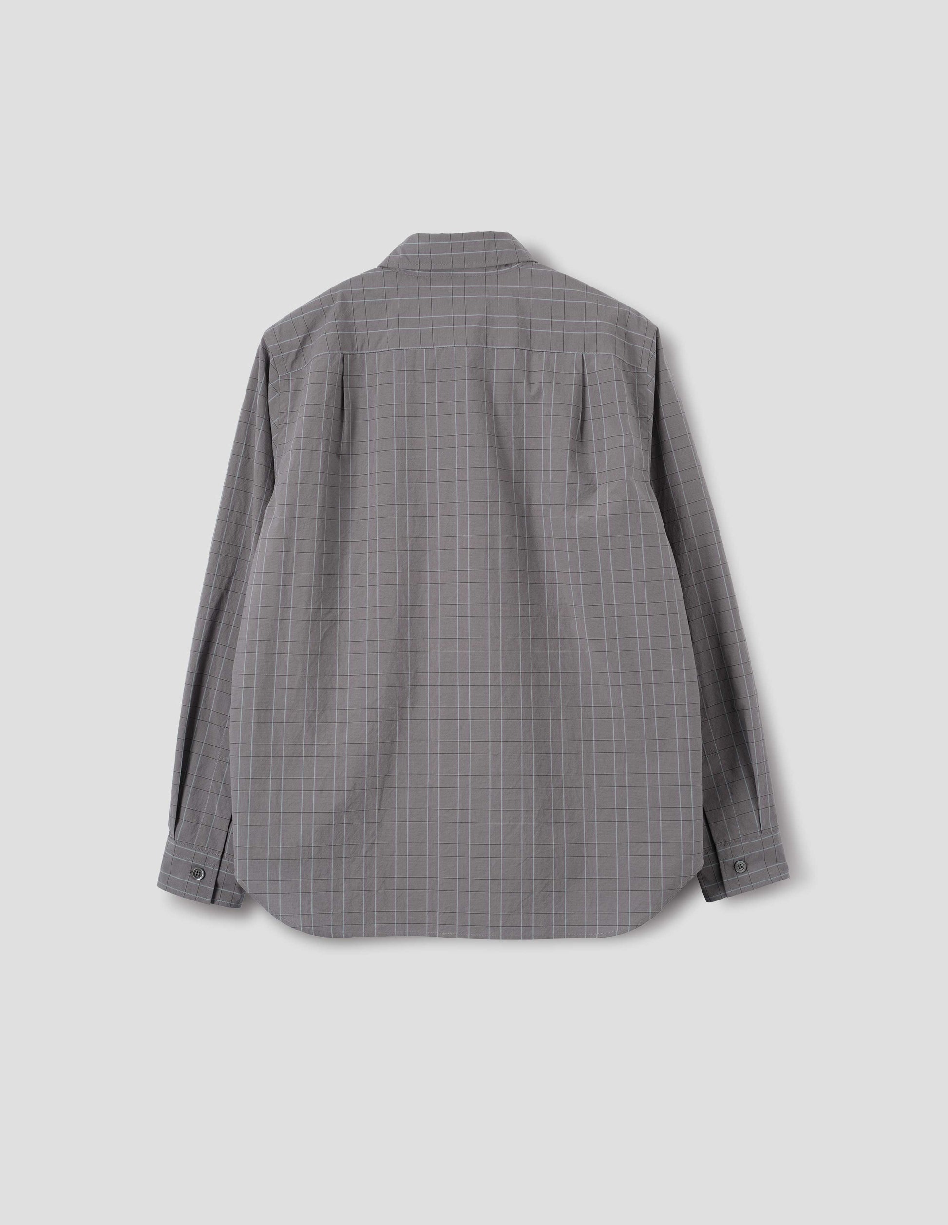 Grey cotton shirt with dark grey and light blue checks, mother of pearl buttons on cuffs, curved hem and pleats on back yoke. Back flat lay view.