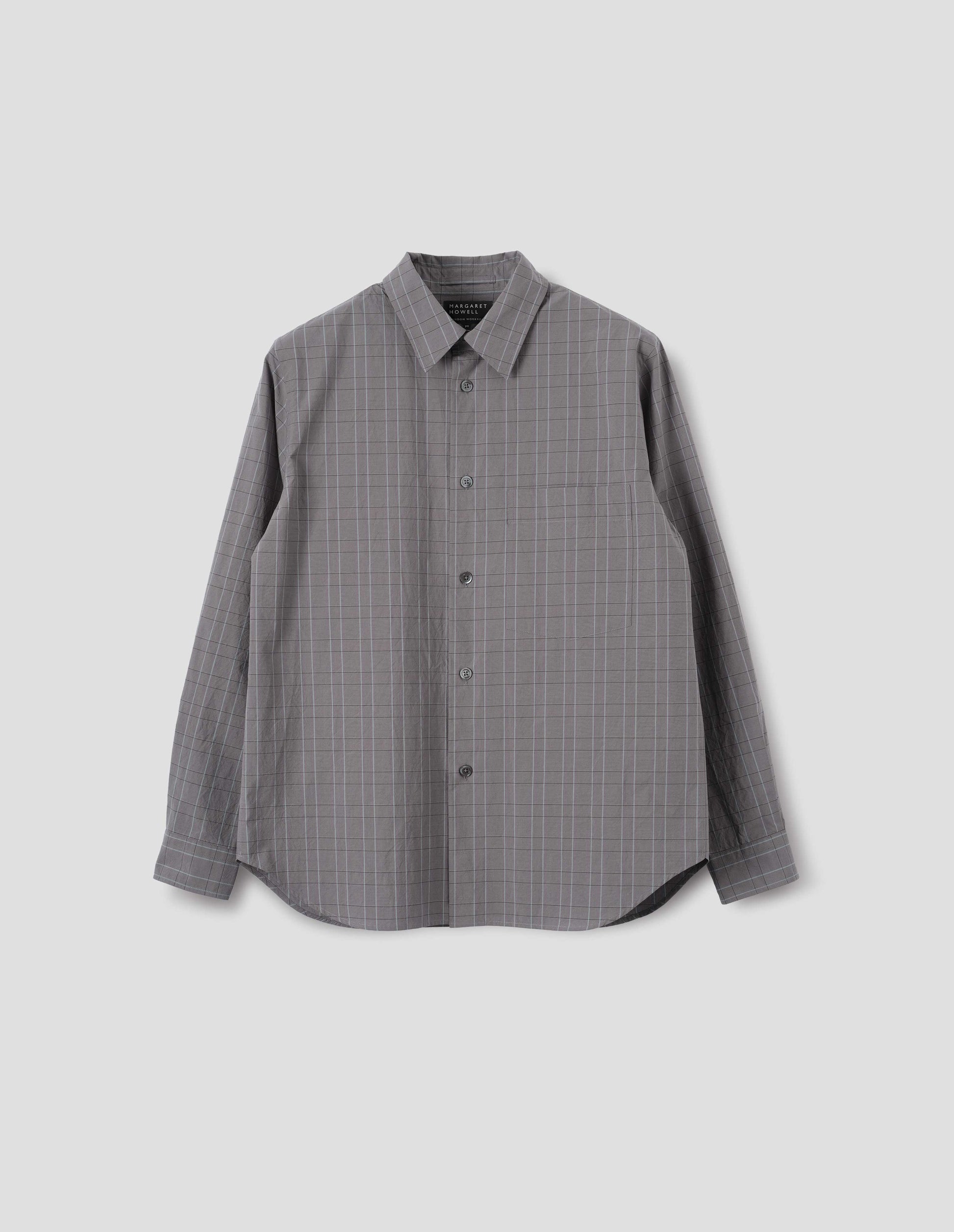 Grey cotton shirt with dark grey and light blue checks, mother of pearl buttons and chest pocket. Front flat lay view.
